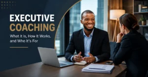 Executive coaching session featuring a professional business coach guiding a corporate leader in a modern office, illustrating leadership development, strategic decision-making, and executive growth.